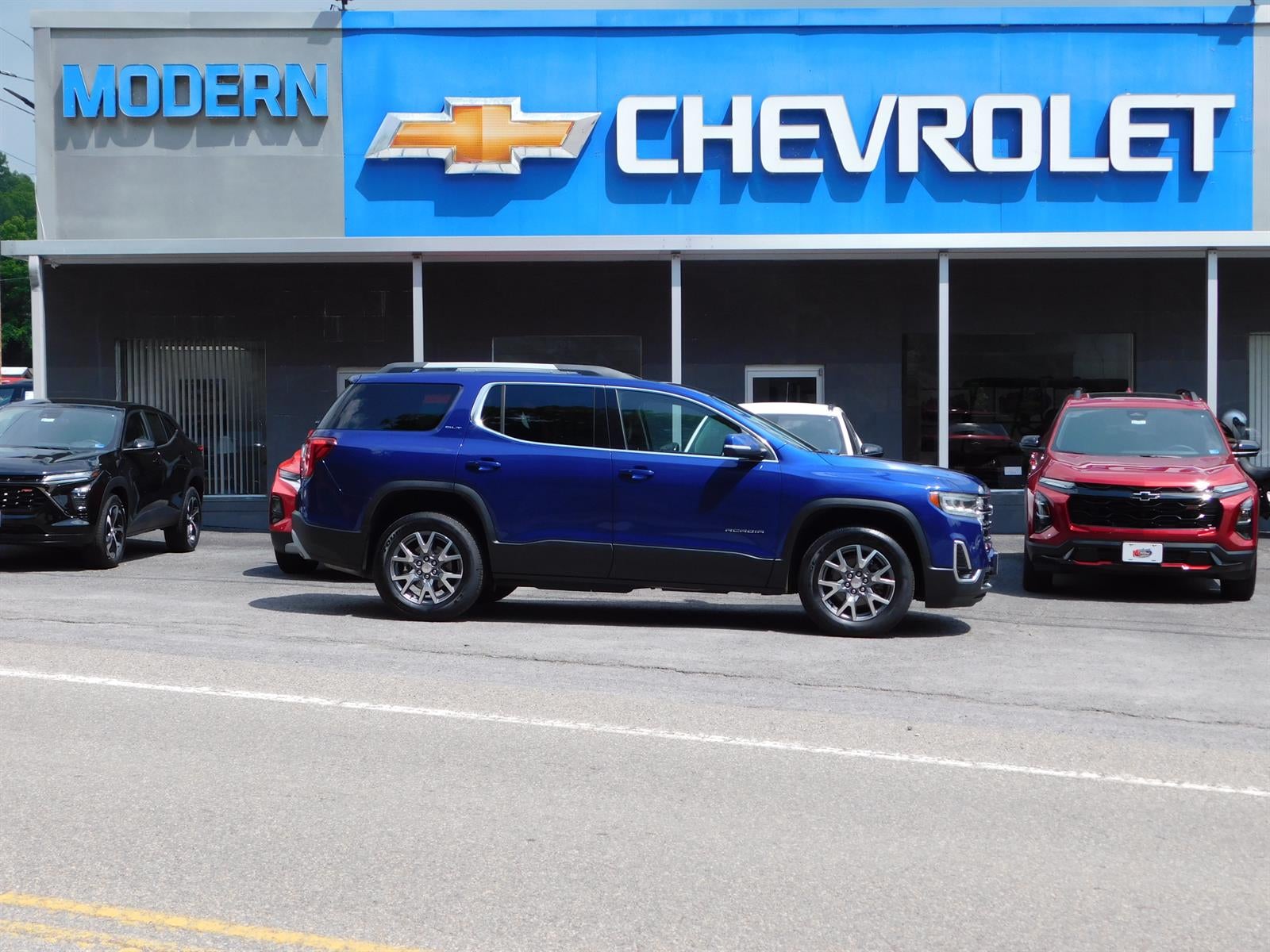 2023 GMC Acadia SLT in Ultra Blue Metallic — front three-quarter view